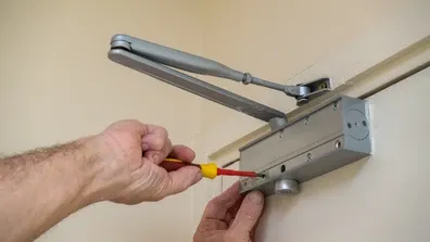 Fire door maintenance work being carried out in a building